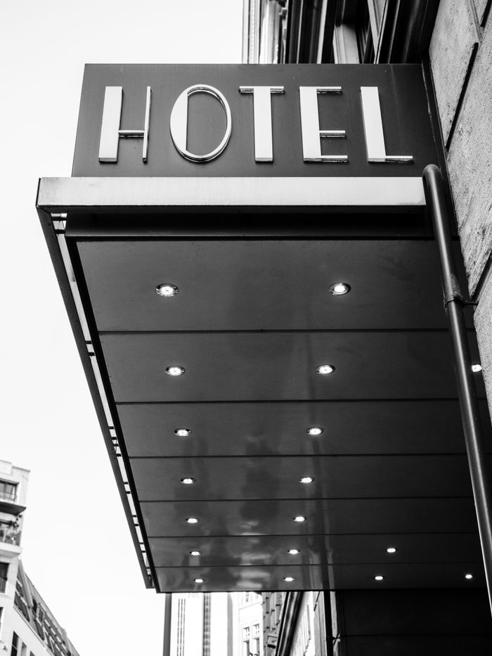 Black and white image of a hotel's modern entrance in Frankfurt, Germany.